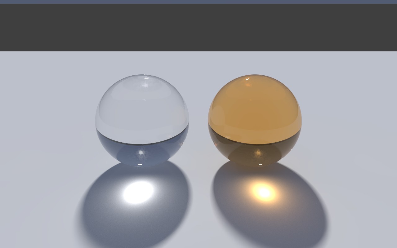 A clear glass ball and an amber one on a pale floor, each casting a bright pool of light in front of it