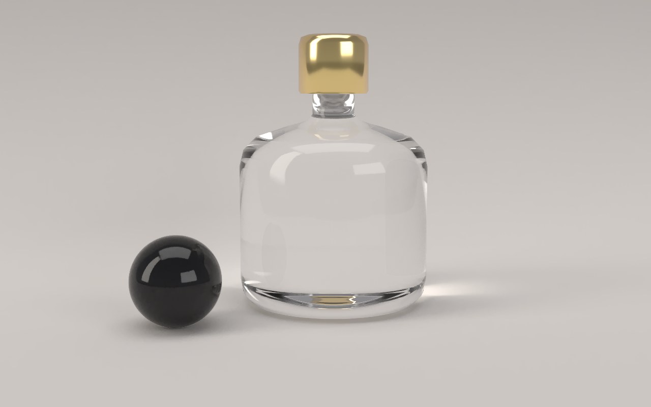 A solid glass perfume bottle with a gold cap and a black stone in a softly lit studio